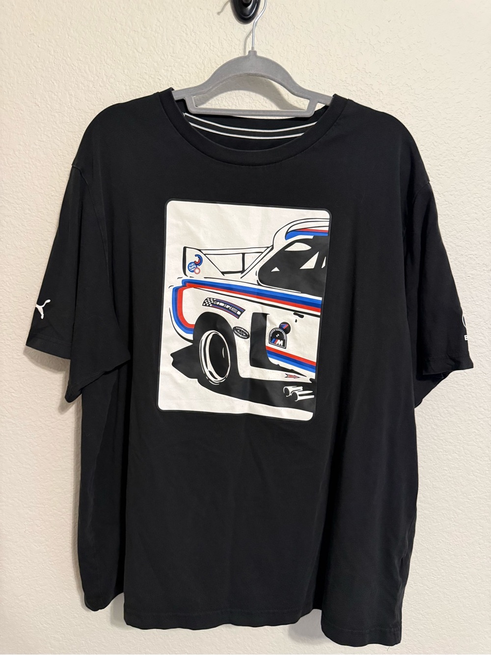 Puma Black Short Sleeve Graphic Racing Tee with Red & Blue Accents